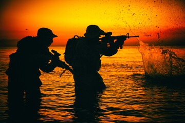 Army soldiers team, special operation forces infantrymen landing on seacoast, aiming and shooting...