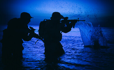 Army soldiers team, special operation forces infantrymen landing on seacoast, aiming and shooting...