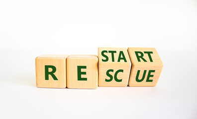 Restart and rescue symbol. Turned cubes and changed the word 'restart' to 'rescue'. Beautiful white background. Business and restart - rescue concept. Copy space.