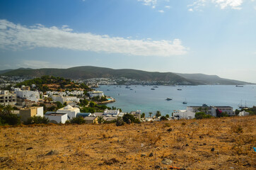 Panoramic View of Aegean sea, traditional white houses marina and Bodrum Castle in Bodrum city of Turkey. Aegean traditional style architecture. Bodrum bay. View from hight