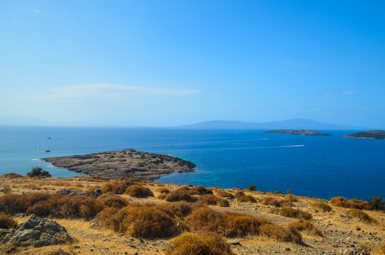 Amazing Seascape from the hill near Bodrum, Turkey. Beautiful tree and srone in front background. Aegean Marine view. Vacation in Turkey