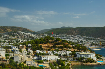 Fototapeta na wymiar Panoramic View of Bodrum downtown, traditional white houses marina. Landscape of Traditional Bodrum Aegean architecture style . Vacation in Turkey