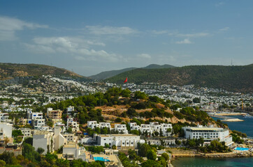 Naklejka premium Panoramic View of Bodrum downtown, traditional white houses marina. Landscape of Traditional Bodrum Aegean architecture style . Vacation in Turkey