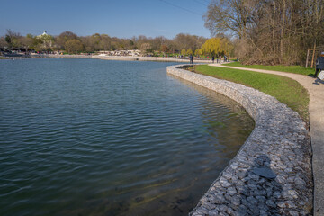 Gennevilliers, France - 02 27 2021: Chanteraines park. Nature in bloom in spring season. View of the artificial pond
