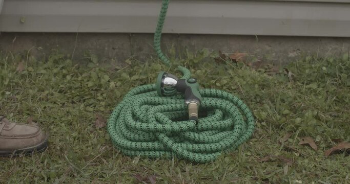 Expanding garden hose triples in size as water fills it.