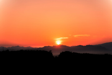 Blue sky background with little clouds, morning sun rising up. In Phuket, Thailand