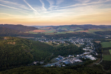 Fototapeta na wymiar Aerial view of Siedlinghausen in Sauerland at sunrise.