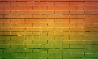 Colorful grunge brick wall background. Green and orange brick wall.