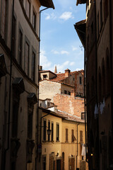 Fototapeta na wymiar Narrow streets of a medieval city. Arezzo, Tuscany.