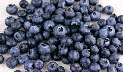 Fototapeta na wymiar Blueberries on a light background. Fresh berries
