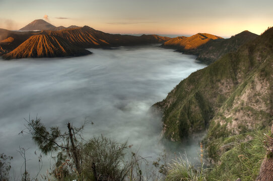 A sea of clouds covers the caldera at sunrise in Bromo-Tengger-Semeru National Park on the island of Java in Indonesia      