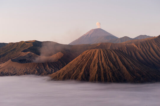 Mount Bromo (large crater, left) at sunrise in Bromo-Tengger-Semeru National Park on the island of Java in Indonesia     