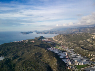 High angle drone aerial view of greenhouse fields of greens plantation in Demre - Antalya province,...