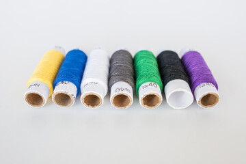  threads for sewing on a white background.