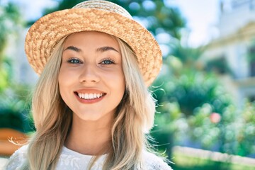 Young caucasian tourist girl smiling happy walking at street of city.