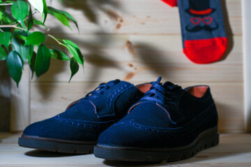 Oxfords with socks on the wooden floor