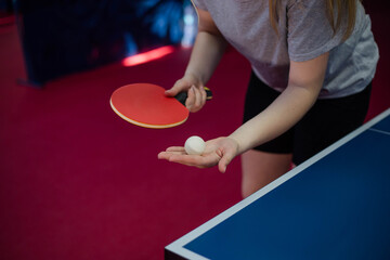 Close up of a female table tennis player serving