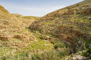 Hikers on the Bank of Prat Brook, Israel
