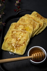 Homemade rghaif or msemen Arab with honey and cream cheese