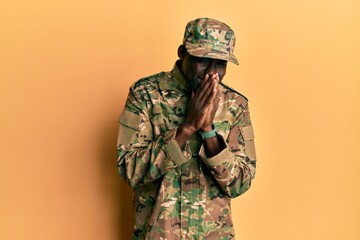 Young african american man wearing army uniform laughing and embarrassed giggle covering mouth with hands, gossip and scandal concept