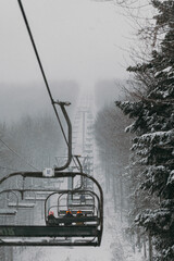 Ski Lift in Snowy and Foggy Weather