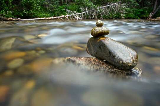 Rocks stacked as cairn in Lincoln Creek near Independence Pass, CO.   