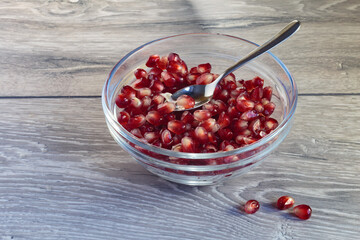 Juicy ripe pomegranate grains. Concept of vegan dessert.