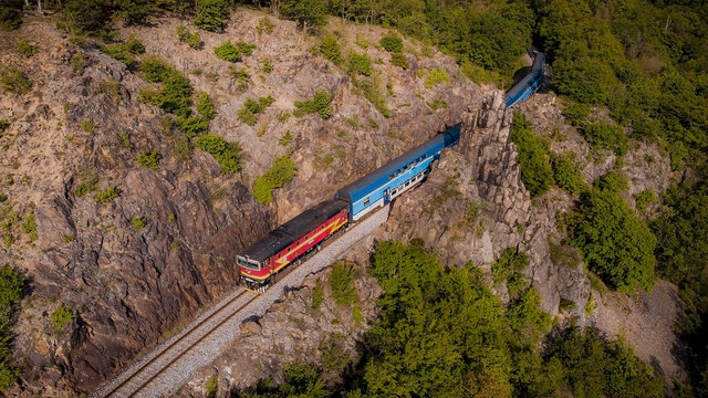 Through the Sazava Valley. The train, Posazavsky Pacifik, rolls around the pinnacle Pikovska Jehla