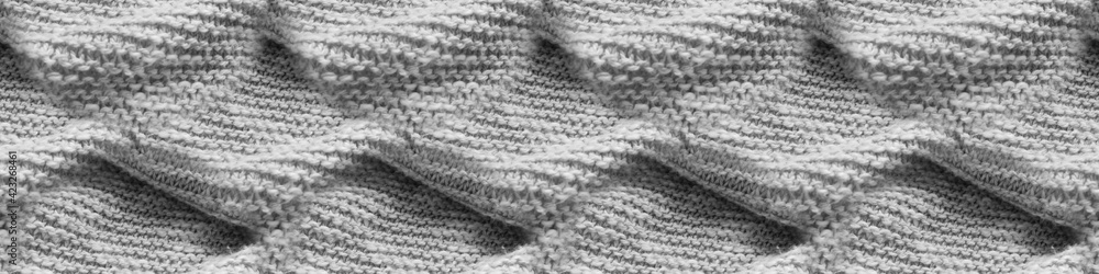 Wall mural cable knit texture. monochrome seamless knitting.