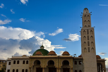 Beautiful cotton clouds behind a mosque in Algiers, Algeria