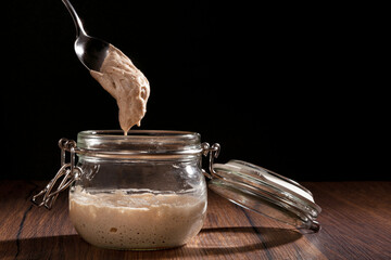 Sourdough starter in glass jar.