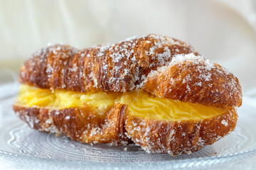 A delicious pastry filled with yellow  custard.