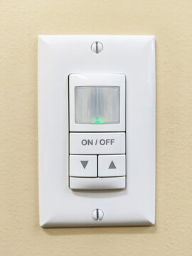 Motion Detection Light Switch on a Yellow Wall