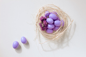 Easter eggs in a nest on white background. Easter concept and symbol
