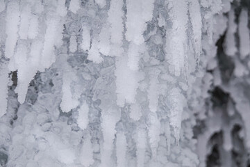 Ice Grotto with Icicles at Baikal Lake in Russia