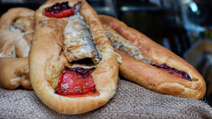 Sardine and roasted red pepper flatbread in a bar in Valencia, Spain
