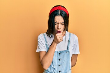 Young hispanic girl wearing casual clothes feeling unwell and coughing as symptom for cold or bronchitis. health care concept.