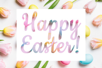 Happy Easter congratulation. Festive layout of light pink and yellow spring flowers tulips and pastel colors easter eggs on a white background. Spring, flat lay.