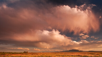Scenic image of storm clouds at sunset over the wetlands of the Great Salt Lake and Antelope Island State Park, Utah.     