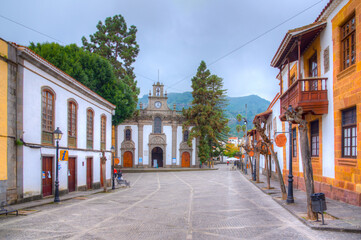 Basilica Nuestra Senora del Pino and traditional houses at the main street of Teror at Gran...