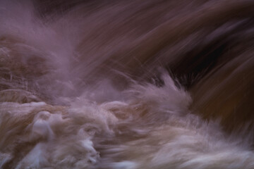 The rushing water of the waterfall