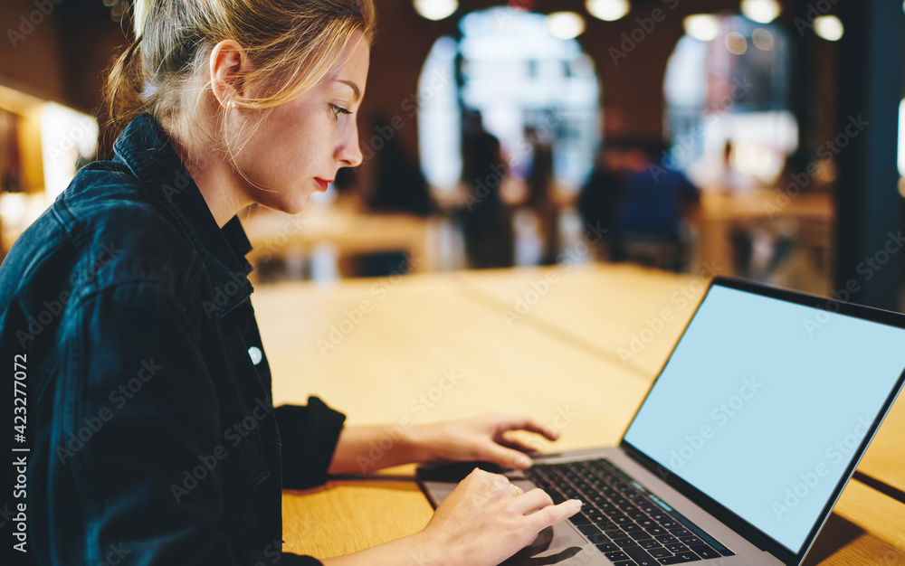 Wall mural caucaisan woman browsing website via blank laptop computer with copy space area for internet adverti