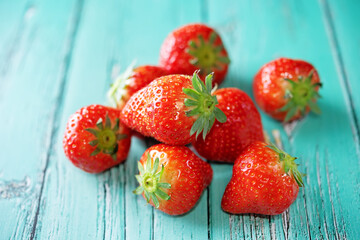 Fresh ripe Strawberries on a wood background