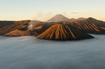 Mount Bromo (large crater, left) at sunrise in Bromo-Tengger-Semeru National Park on the island of Java in Indonesia     