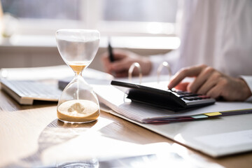 Obraz na płótnie Canvas Accountant Calculating Invoice Bill In Time