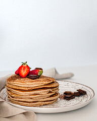 stack of pancakes with strawberries