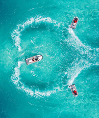 Jet Ski water sport lifestyle. Aerial view clear turquoise sea. Maldives tropical island summer vacation.