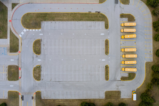 Middle of the day on school buses parked near the high school