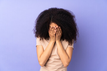 Young african american woman isolated on purple background with tired and sick expression