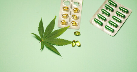 Cannabis leaf. Medical marijuana pharmaceuticals. CBD oil tablets. Alternative medicine pills banner